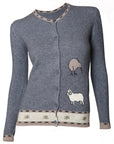 A gray cardigan with a kiwi patch on the front, featuring a round neckline and short sleeves. Possum fur is visible on the cuffs.