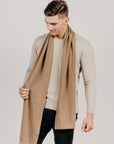 Man wearing a light brown Classic Cervelt Scarf - Kapeka NZ, Made from New Zealand Red Deer Fibre. Very Soft and rare Fibre. Only made in New Zealand