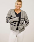 Woman wearing a Merinosilk Lakeside Sweater and cardigan- Kapeka NZ