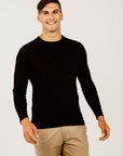 Man wearing a long sleeve shirt with beife pants