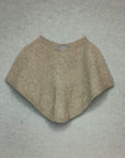Beige poncho on a gray background