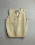 Beige baby sweater vest on a gray background