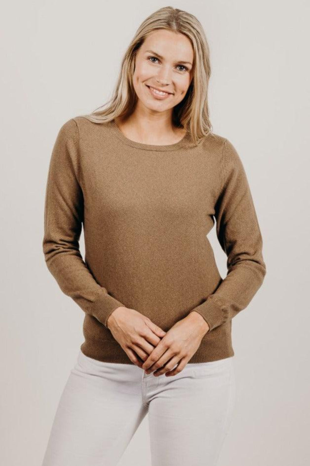 Woman wearing a light brown Classic Cervelt Scarf - Kapeka NZ, Made from New Zealand Red Deer Fibre. Very Soft and rare Fibre. Only made in New Zealand