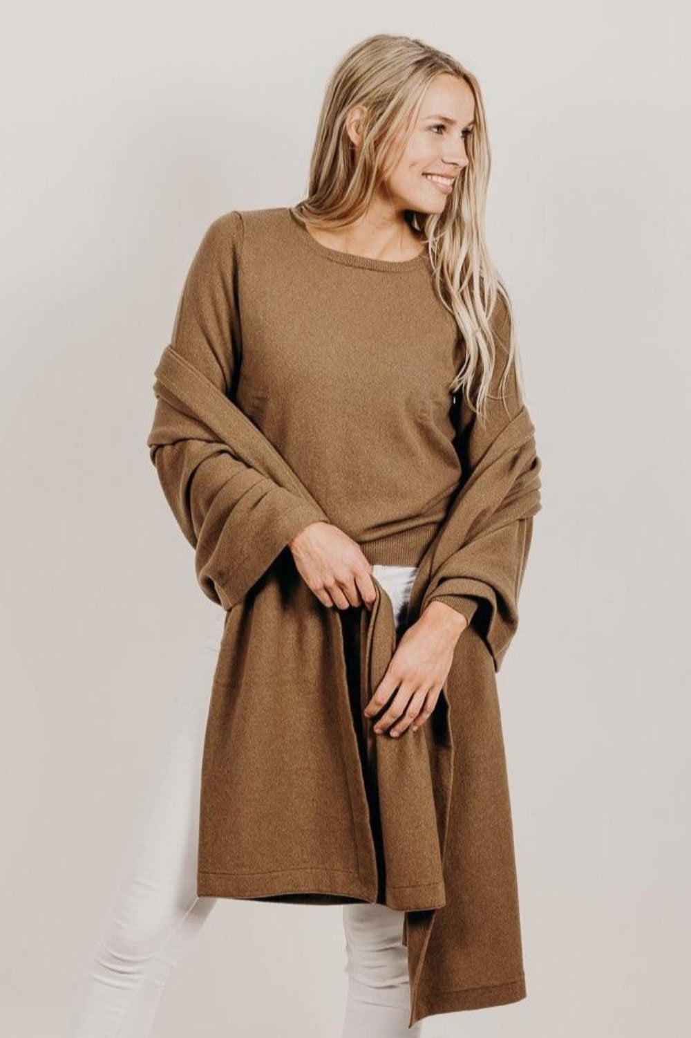 Woman wearing a light brown Classic Cervelt Scarf - Kapeka NZ, Made from New Zealand Red Deer Fibre. Very Soft and rare Fibre. Only made in New ZealandCervelt Luxury Sweater - Kapeka NZ
