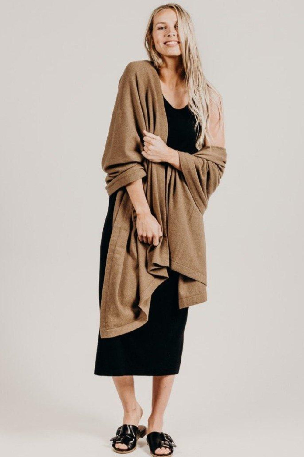 Woman wearing a light brown Classic Cervelt Scarf - Kapeka NZ, Made from New Zealand Red Deer Fibre. Very Soft and rare Fibre. Only made in New Zealand