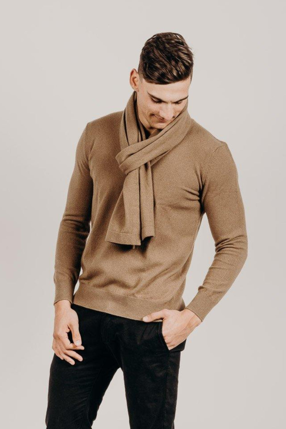 Man wearing a light brown Classic Cervelt Scarf and sweater - Kapeka NZ, Made from New Zealand Red Deer Fibre. Very Soft and rare Fibre. Only made in New Zealand