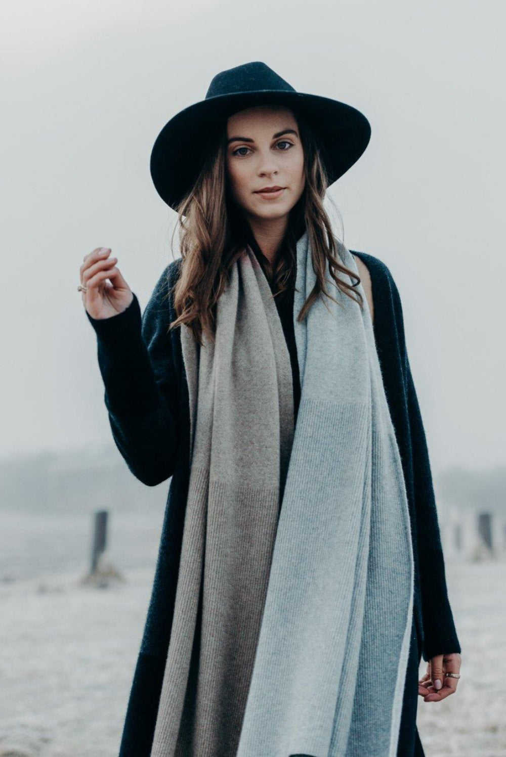 Woman wearing a Merinosilk Lodge Wrap and hat outside- Kapeka NZ