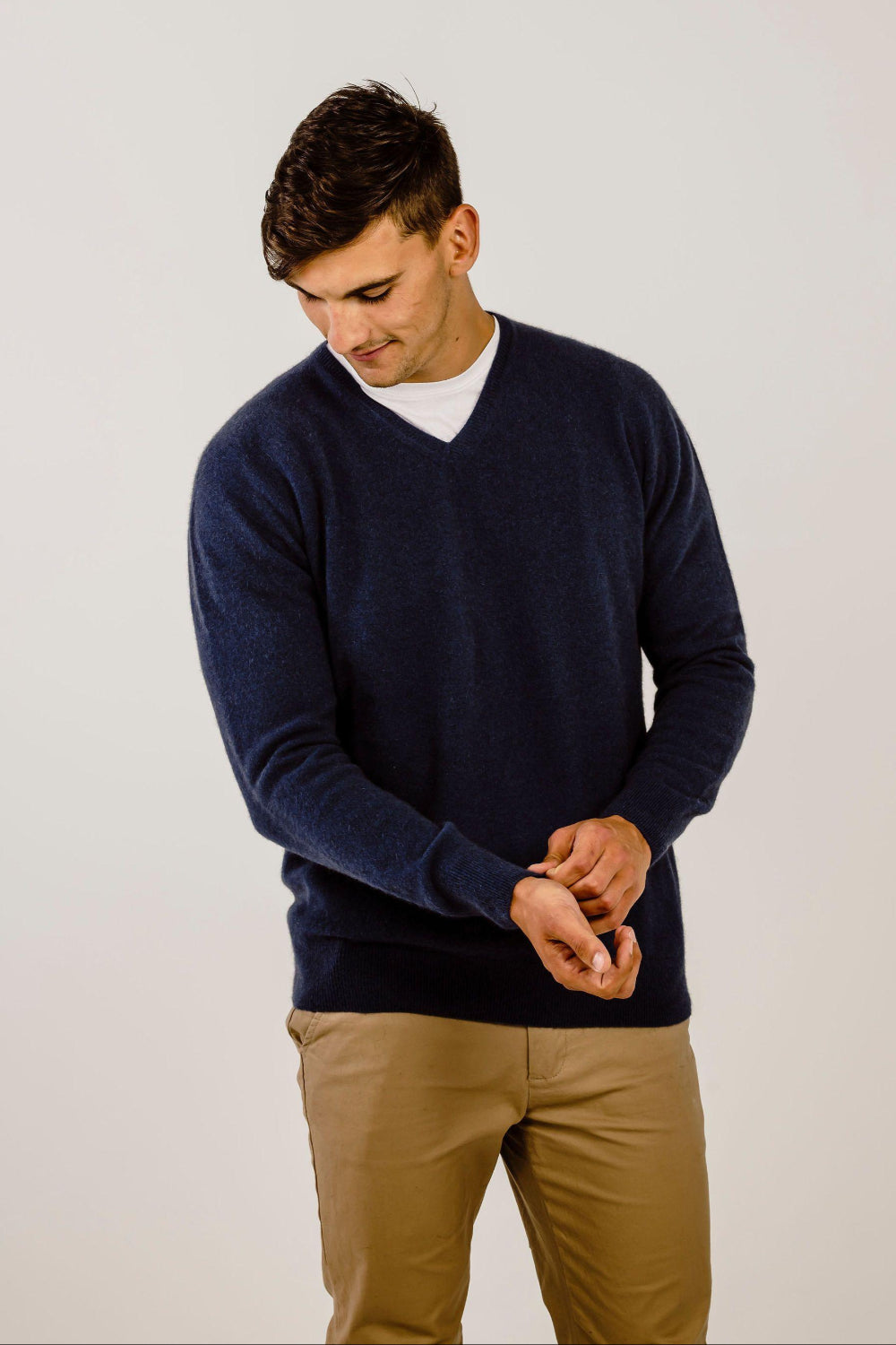 Man wearing a blue Cashmere V Neck Sweater - Kapeka NZ