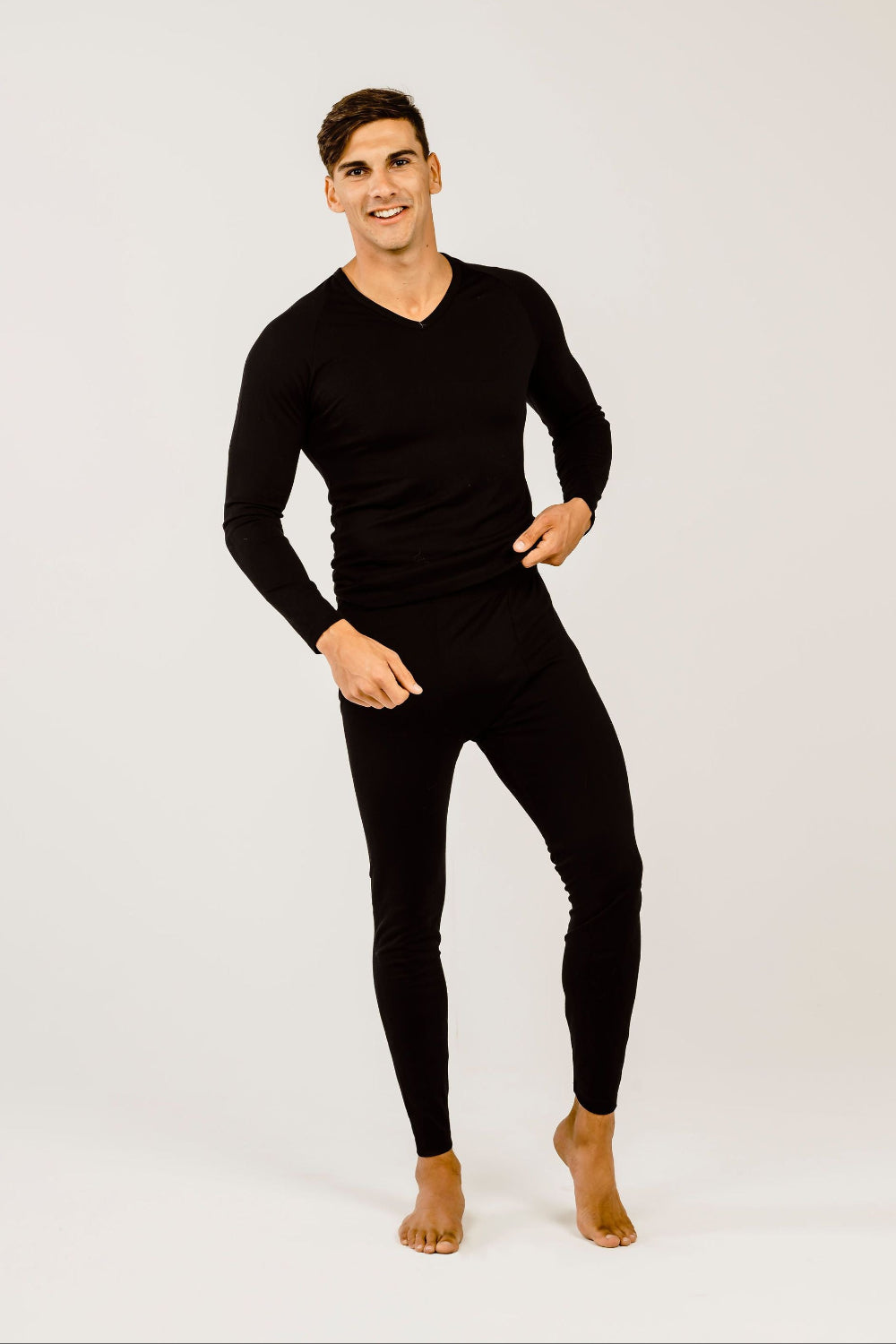 Person wearing black leggings on a white background