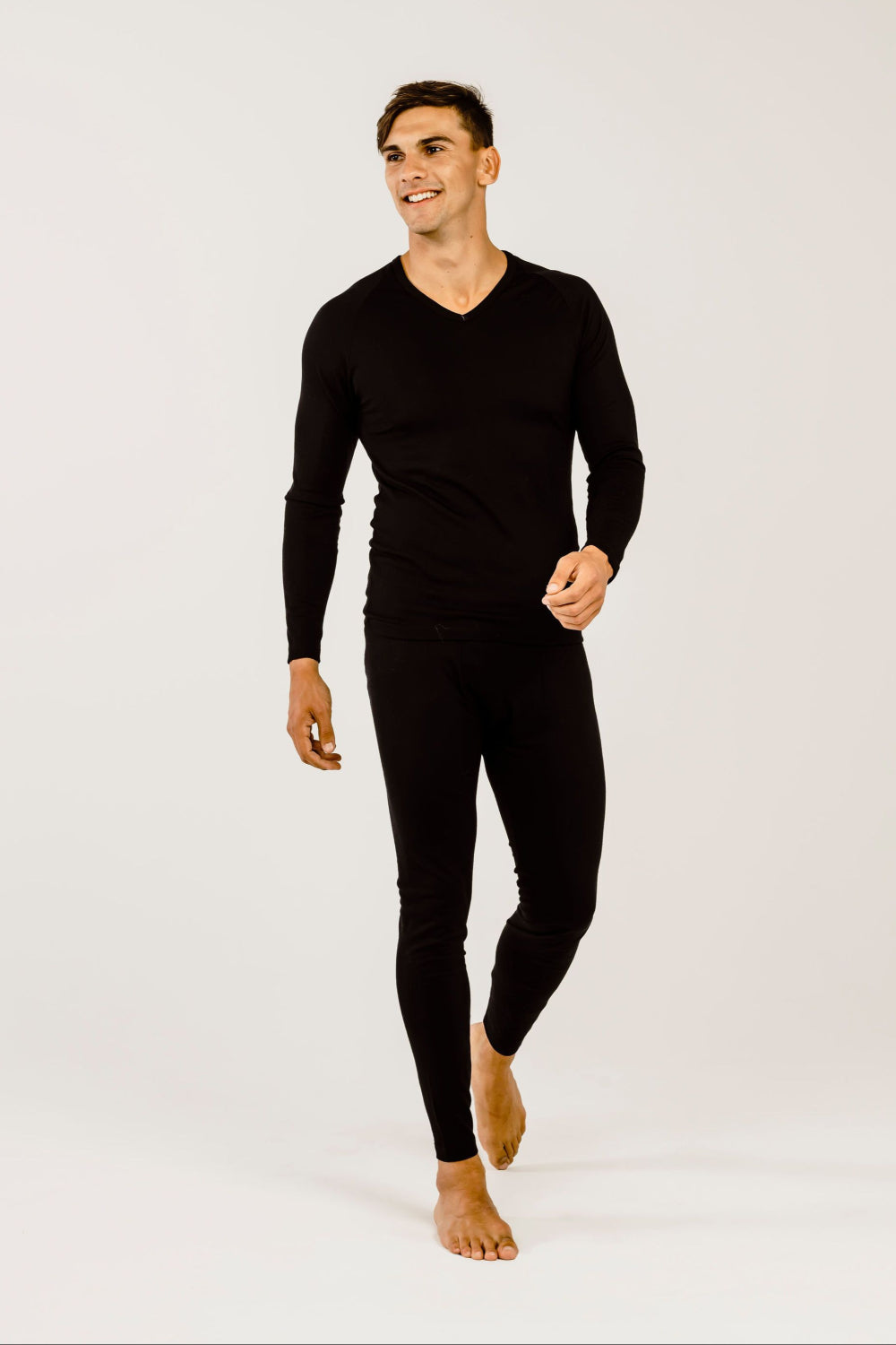Person wearing black leggings on a white background