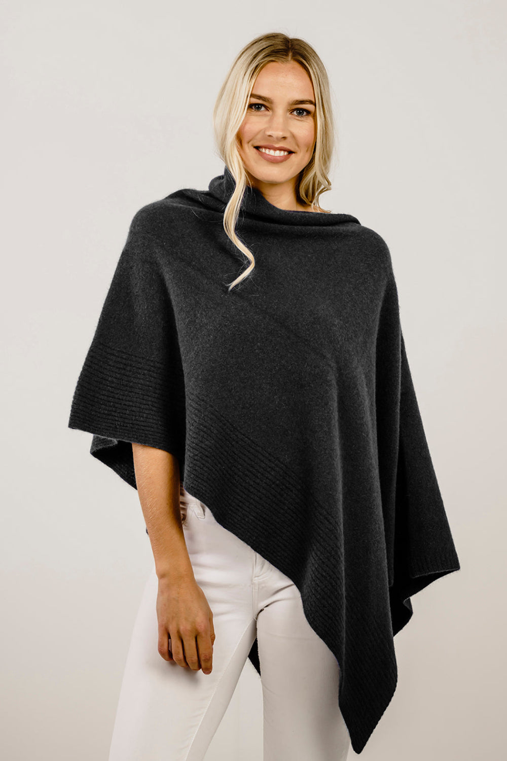 Woman wearing a charcoal wrap poncho